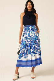 A model wearing the Yacht Party Skirt in colour Messina (Blue), from the front, showing the whole outfit