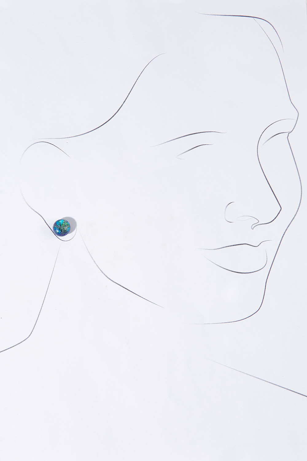 A model wearing size OneSize of the Medium Glass Stud Earrings in colour Marine (Blue), from the front, showing the whole outfit