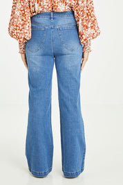 Model Tahlia wearing size 10 of the Simone Jean in colour Wornwash (Blue), from the back