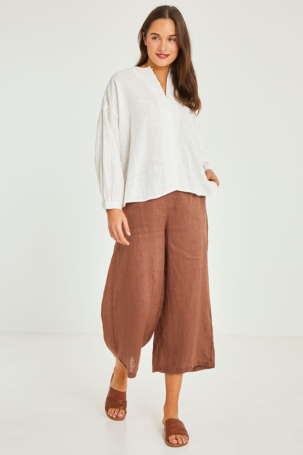 Model Elhana wearing size 10 of the Cerise Top in colour White (White), from the front, showing the whole outfit