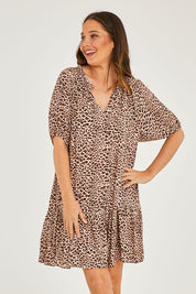 Model Georgia wearing size 10 of the Camilla Dress in colour Animal (Black), from the front, cropped image