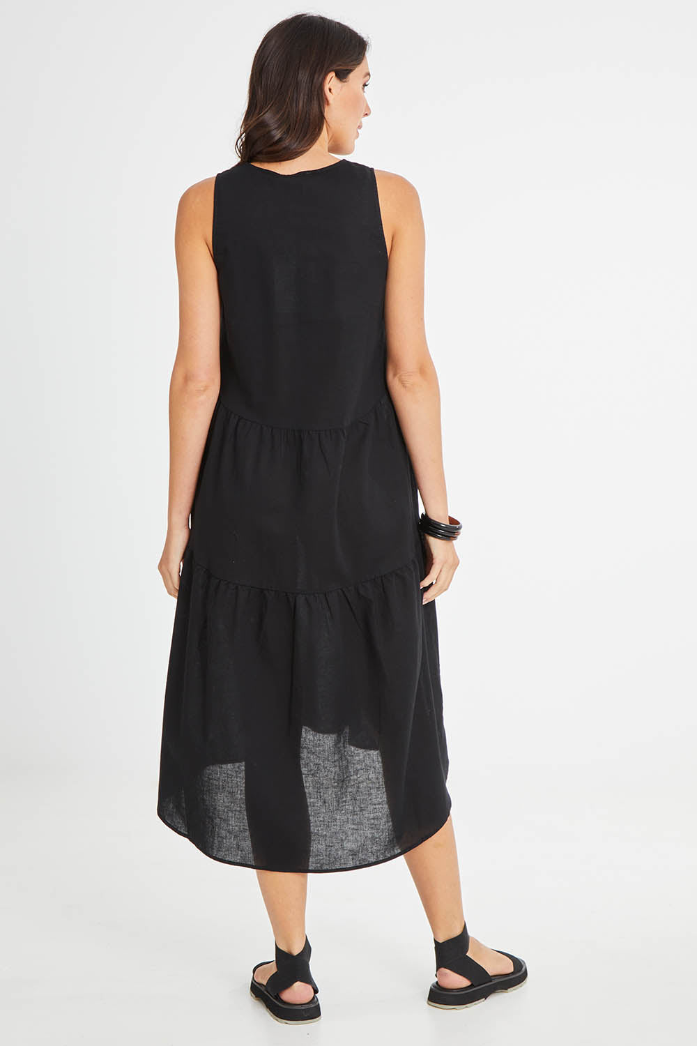 Model Madeline wearing size 10 of the Alina Midi Dress in colour Black (Black), from the front, showing the whole outfit