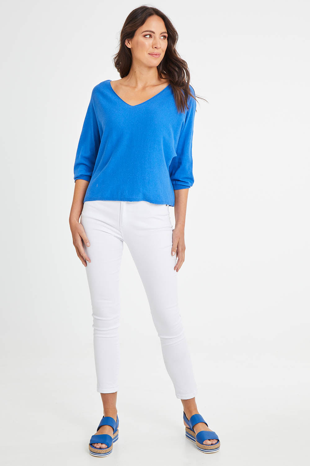 Model Madeline wearing size 10 of the Donna Knit Top in colour Cobalt (Blue), from the front, showing the whole outfit