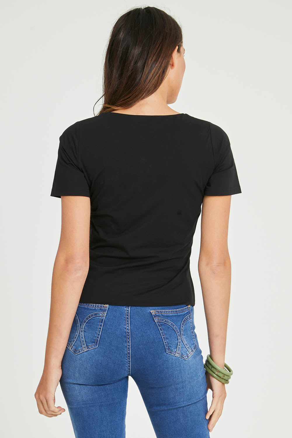 Model Madeline wearing size 10 of the Claire V Neck Tee in colour Black (Black), from the back