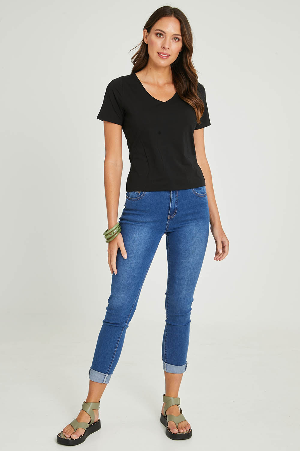 Model Madeline wearing size 10 of the Claire V Neck Tee in colour Black (Black), from the front, showing the whole outfit
