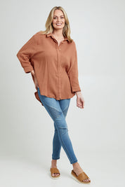 Model Grace wearing size 10 of the Felix Oversized Shirt in colour Mocha, from the front, showing the whole outfit