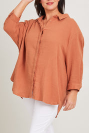Model Poppy wearing size 16 of the Felix Oversized Shirt in colour Mocha, from the front, cropped image