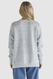 A model wearing the Kirsha Jumper in colour Bluemarle (Blue), from the back