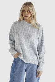 A model wearing the Kirsha Jumper in colour Bluemarle (Blue), from the front, cropped image