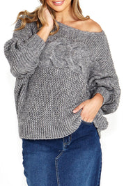 A model wearing the Belinda Chunky Cable Knit in colour Greymarle (Grey), from the front, cropped image