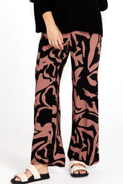 A model wearing the Joelle Wide Leg Pant in colour Abstract, from the front, cropped image