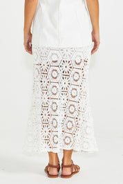 A model wearing the Clover Lace Cotton Skirt in colour White (White), from the back