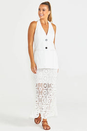 A model wearing the Clover Lace Cotton Skirt in colour White (White), from the front, showing the whole outfit
