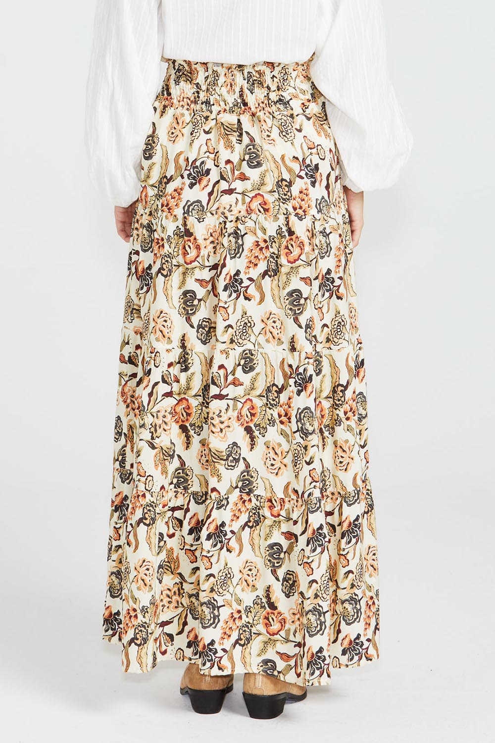 A model wearing the Dara Boho Skirt in colour Wildflower, from the back