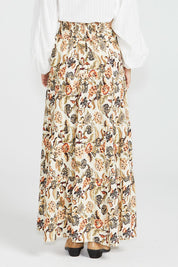 A model wearing the Dara Boho Skirt in colour Wildflower, from the back