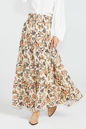 A model wearing the Dara Boho Skirt in colour Wildflower, from the front, cropped image
