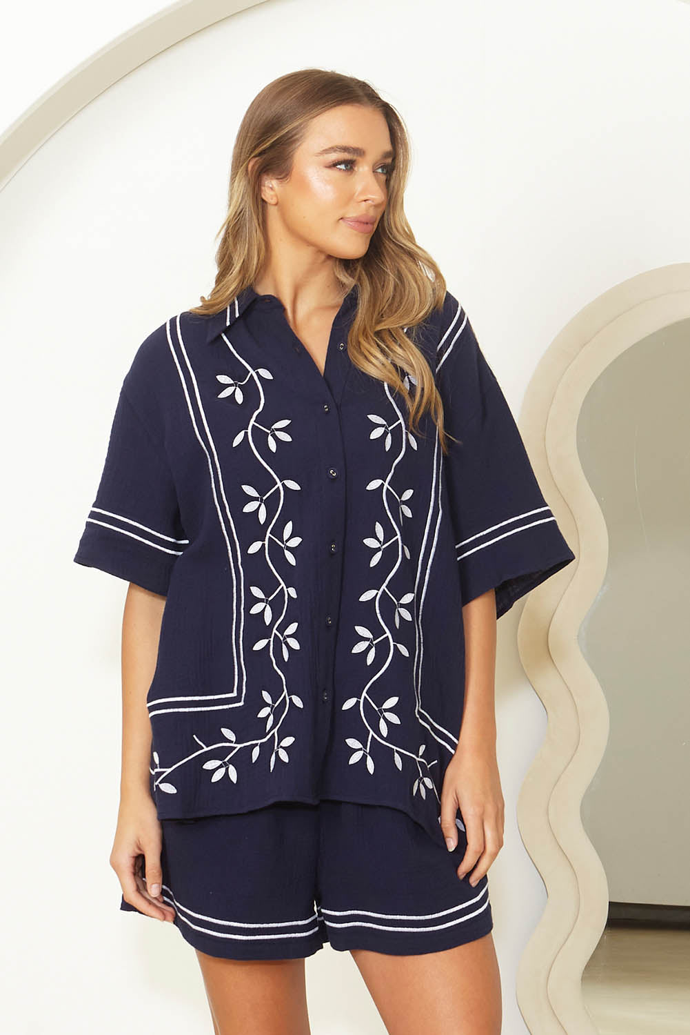 A model wearing the Jayden Cotton Short Sleeve Shirt in colour Navy (Blue), from the front, showing the whole outfit