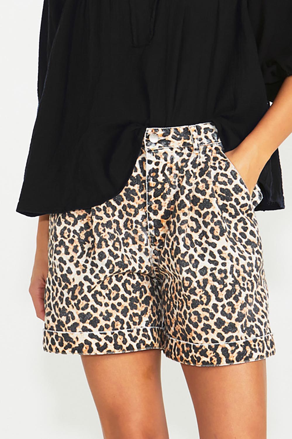 A model wearing the Wyatt Denim Shorts in colour Animal, from the front, cropped image