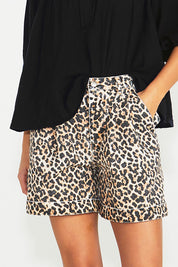A model wearing the Wyatt Denim Shorts in colour Animal, from the front, cropped image