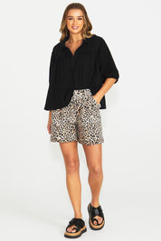 A model wearing the Wyatt Denim Shorts in colour Animal, from the front, showing the whole outfit