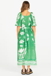 A model wearing the Lyndel Dress in colour Green (Green), from the back