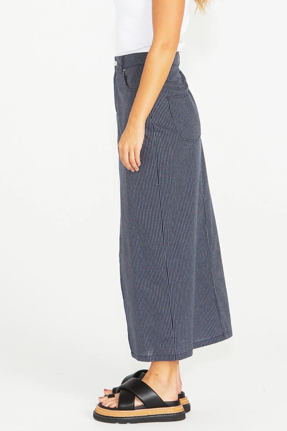 A model wearing the Liberty Cotton Maxi Skirt in colour Navy (Blue), from the front, cropped image