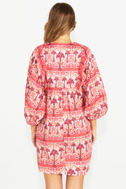 A model wearing the Zayda Cotton Dress in colour Arabian (Pink), from the back