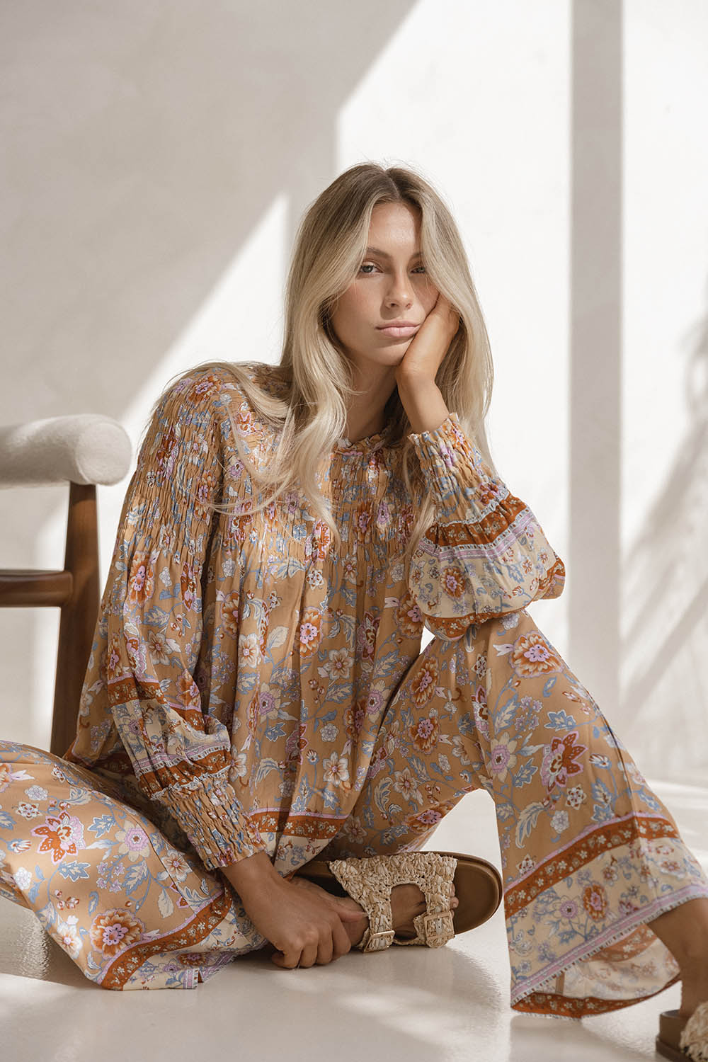 A model wearing the Margie Top in colour Paisley, from the front, showing the whole outfit