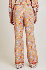 Model Ziara wearing size 10 of the Margie Pant in colour Paisley, from the back