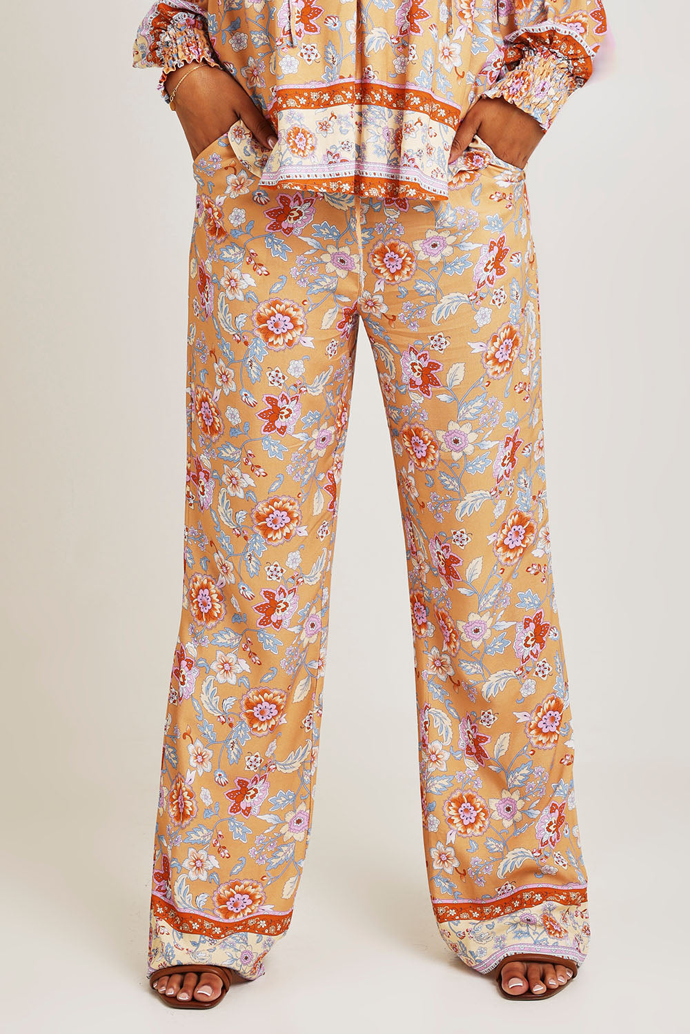 Model Ziara wearing size 10 of the Margie Pant in colour Paisley, from the front, cropped image