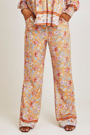 Model Ziara wearing size 10 of the Margie Pant in colour Paisley, from the front, cropped image