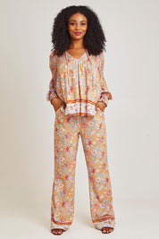 Model Ziara wearing size 10 of the Margie Pant in colour Paisley, from the front, showing the whole outfit