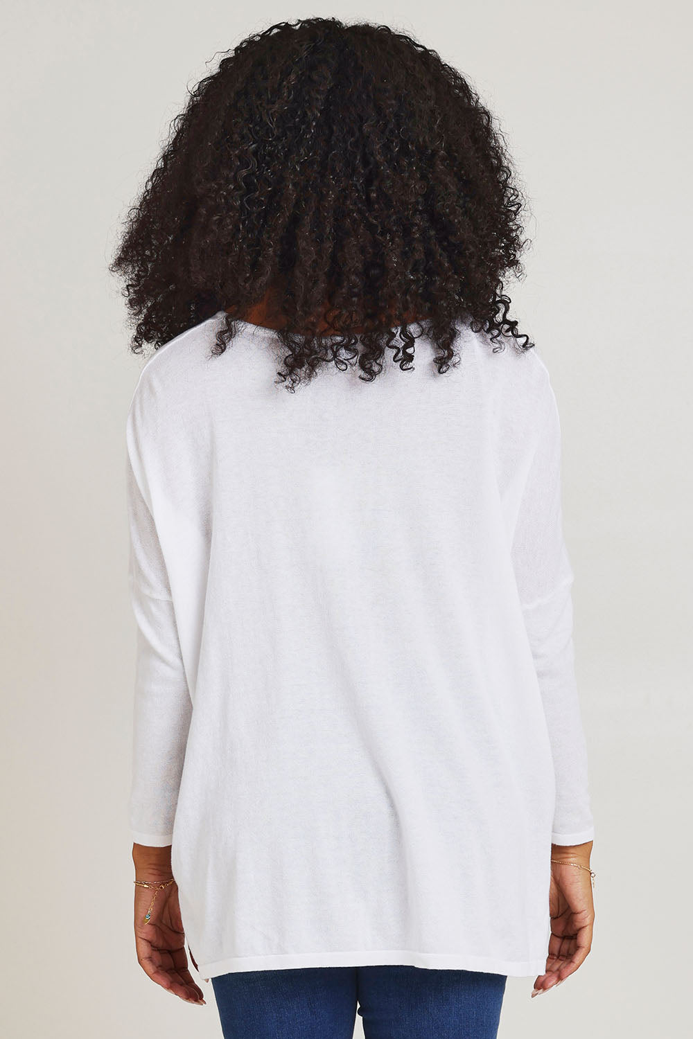 Model Ziara wearing size 10 of the Khaleesi Cotton Knit Top in colour White (White), from the back