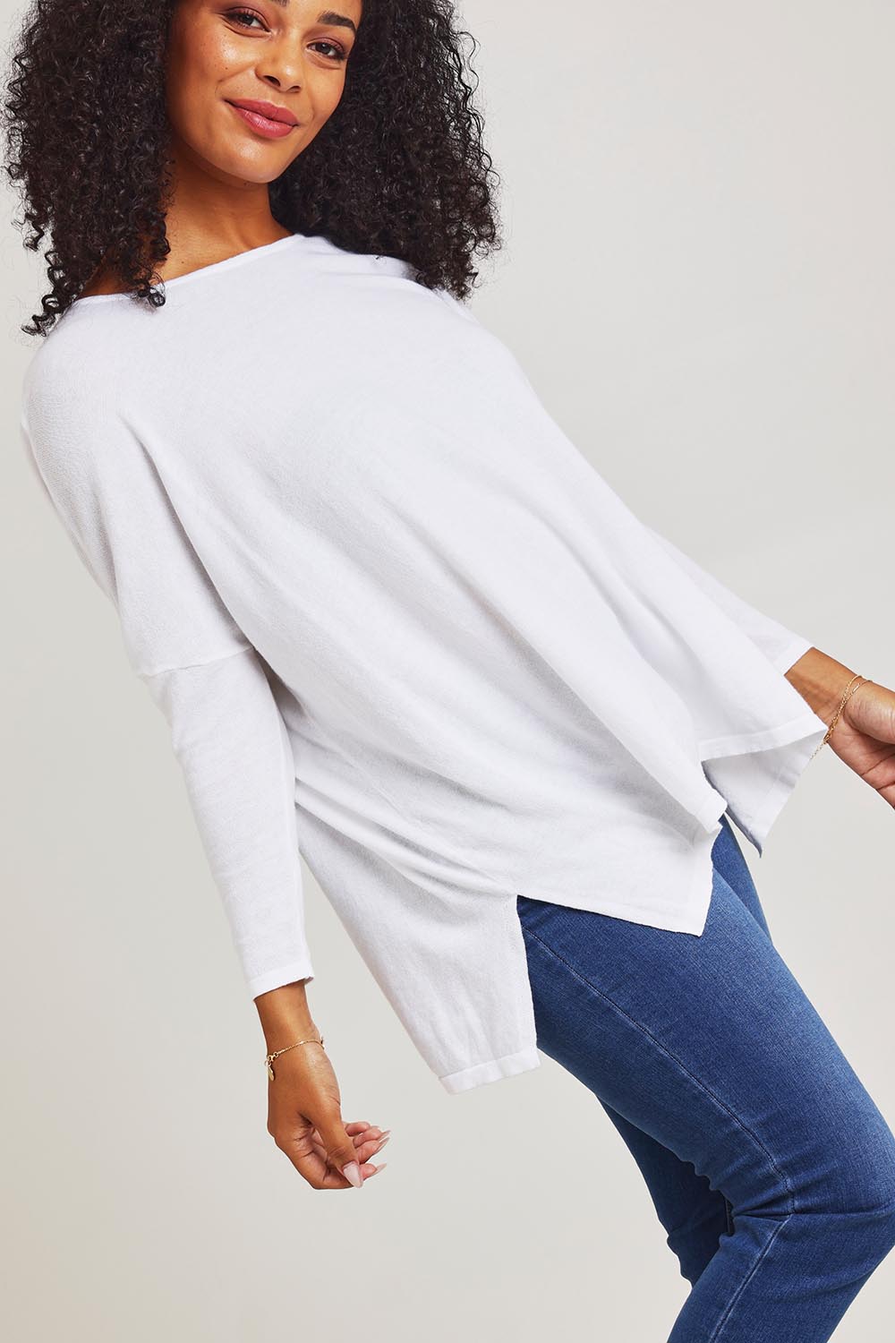Model Ziara wearing size 10 of the Khaleesi Cotton Knit Top in colour White (White), from the front, cropped image