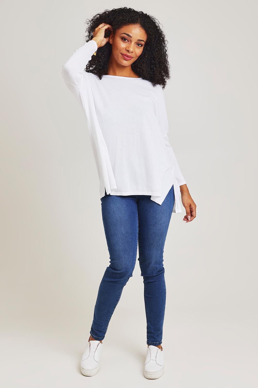 Model Ziara wearing size 10 of the Khaleesi Cotton Knit Top in colour White (White), from the front, showing the whole outfit