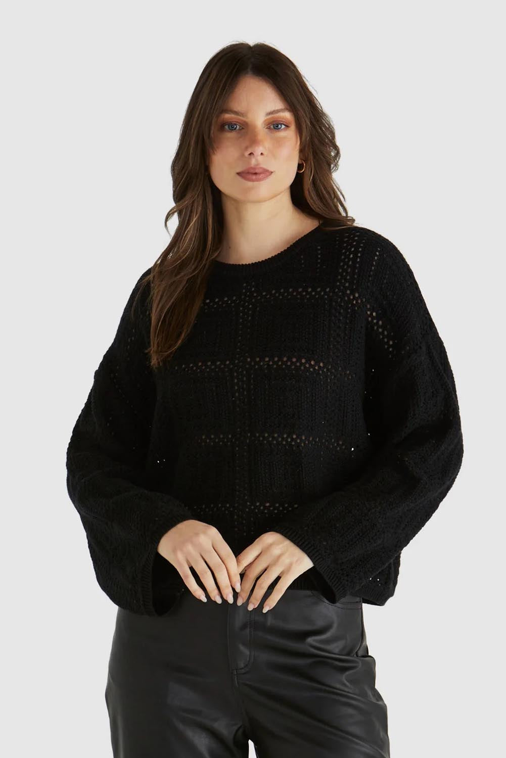 A model wearing the Marcello Cotton Crochet Top in colour Black (Black), from the front, cropped image