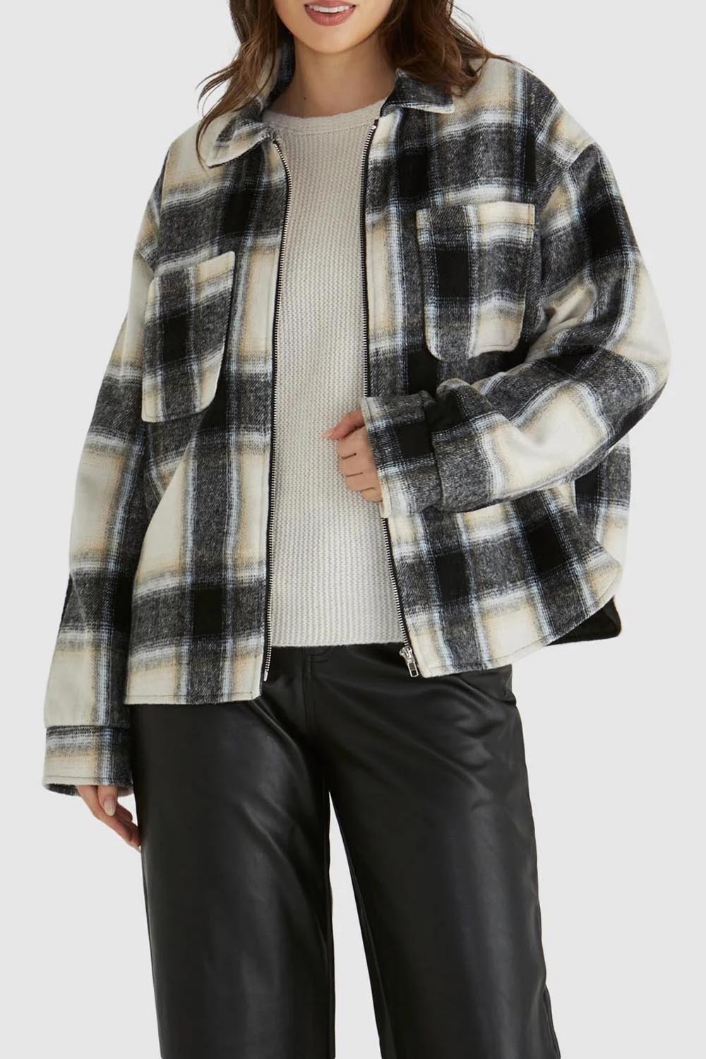 A model wearing the Zita Jacket in colour Charcoal (Grey), from the front, cropped image