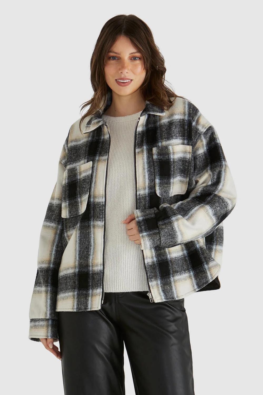 A model wearing the Zita Jacket in colour Charcoal (Grey), from the front, cropped image