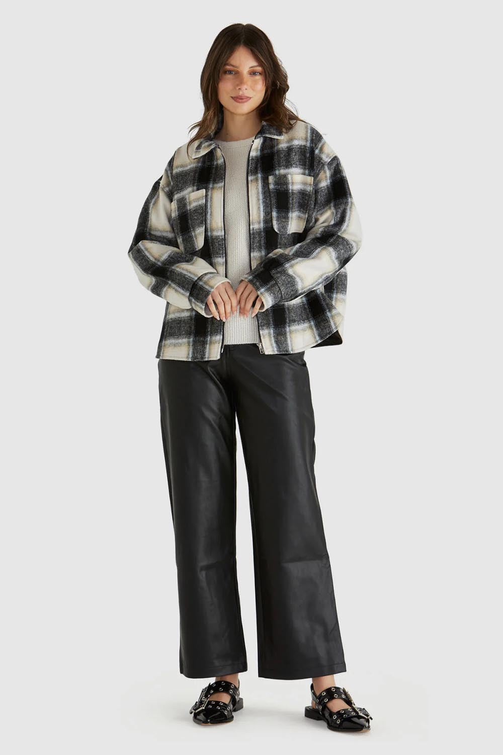 A model wearing the Zita Jacket in colour Charcoal (Grey), from the front, showing the whole outfit