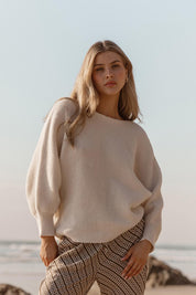 A model wearing the Concord Cotton Blend Knit in colour Cream (White), from the front, showing the whole outfit