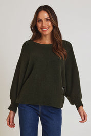 Model Madeline wearing size 10 of the Concord Cotton Blend Knit in colour Forest (Green), from the front, cropped image