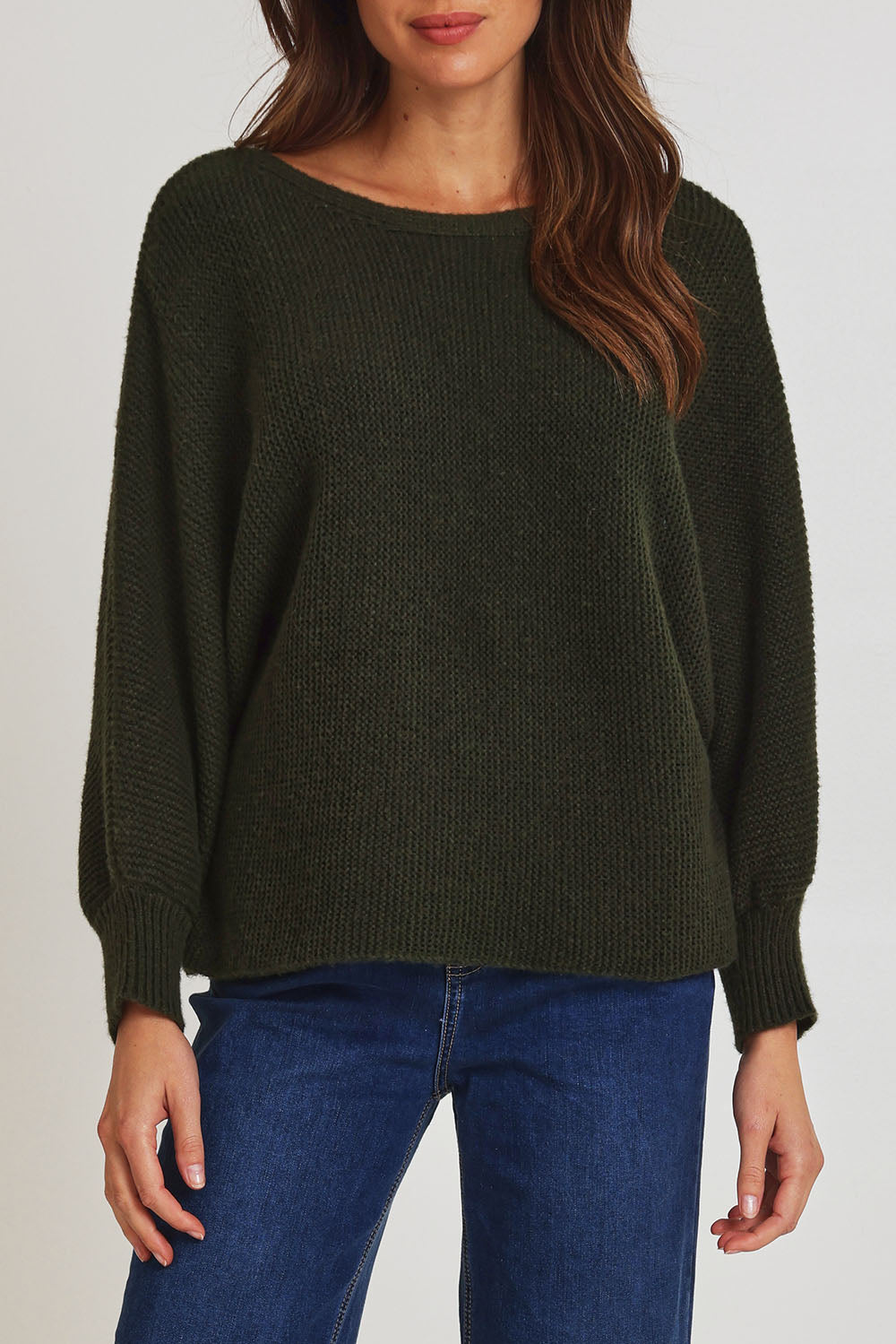 Model Madeline wearing size 10 of the Concord Cotton Blend Knit in colour Forest (Green), from the front, cropped image