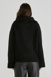 A model wearing the Bennett Knit Jumper in colour Black (Black), from the back