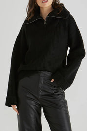 A model wearing the Bennett Knit Jumper in colour Black (Black), from the front, cropped image