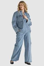 A model wearing the Jordon Top in colour Acidwash (Blue), from the front, showing the whole outfit
