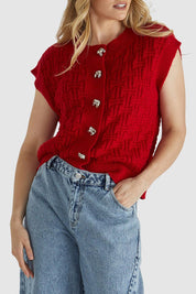 A model wearing the Zadie Vest in colour Poppyred (Red), from the front, cropped image