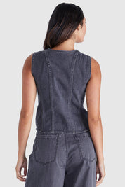 A model wearing the Ainsley Vest in colour Darkdenim (Black), from the back