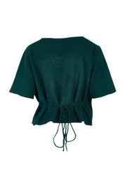 Product shot of the Casey Cardi in colour Teal (Green), from the back