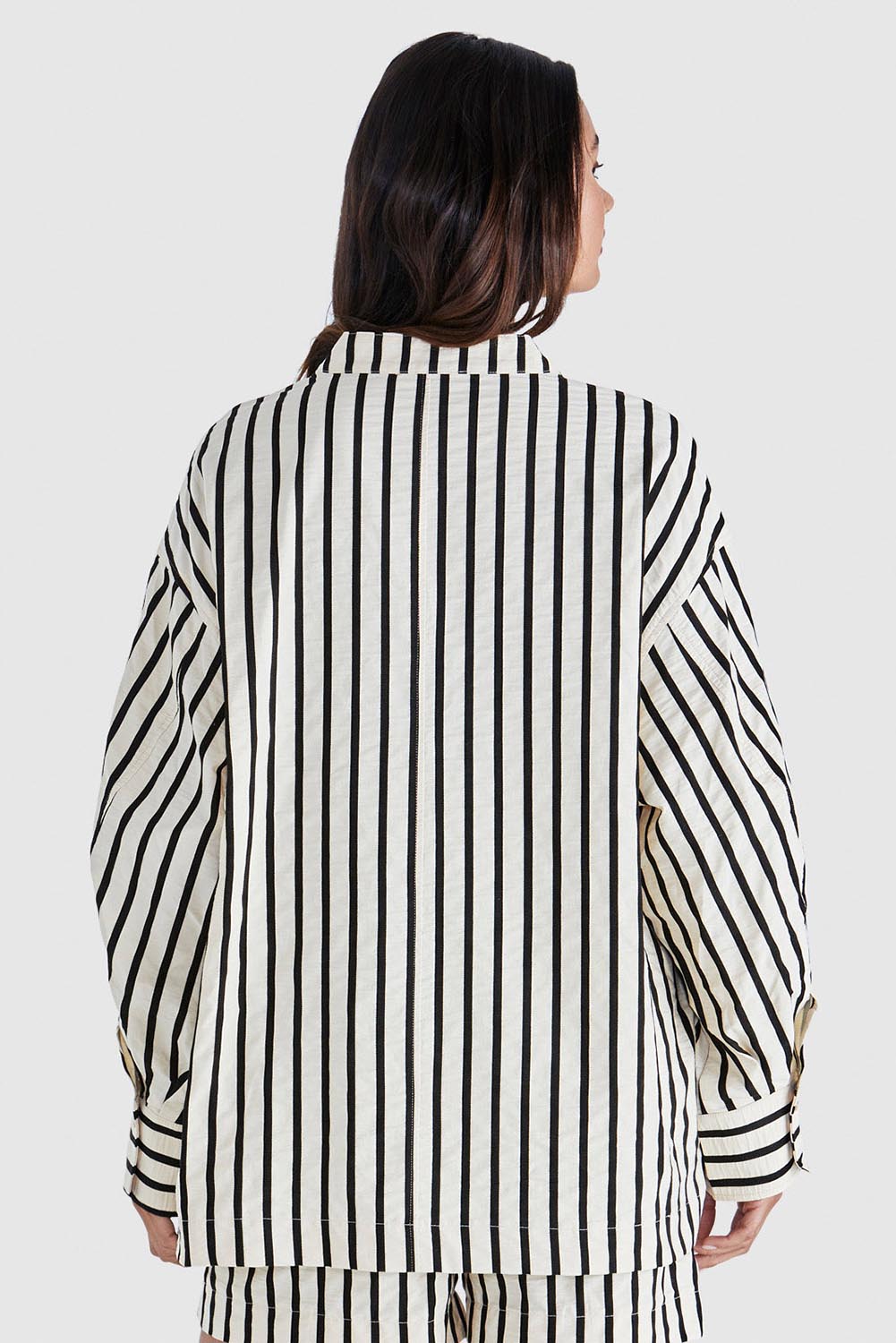 A model wearing the Rohan Cotton Top in colour Stripe, from the back
