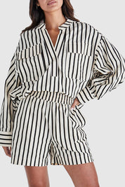 A model wearing the Rohan Cotton Top in colour Stripe, from the front, cropped image